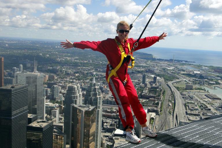 kasia in a red jumpsuit on the CN tower edge walk