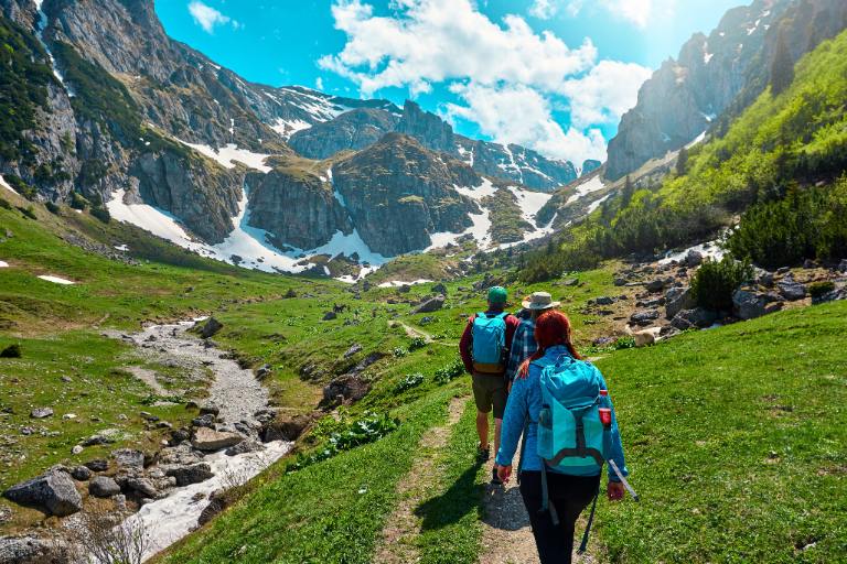 group hiking through mountains