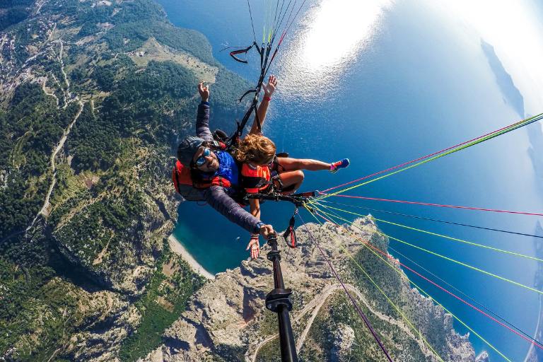 two people paragliding tandem