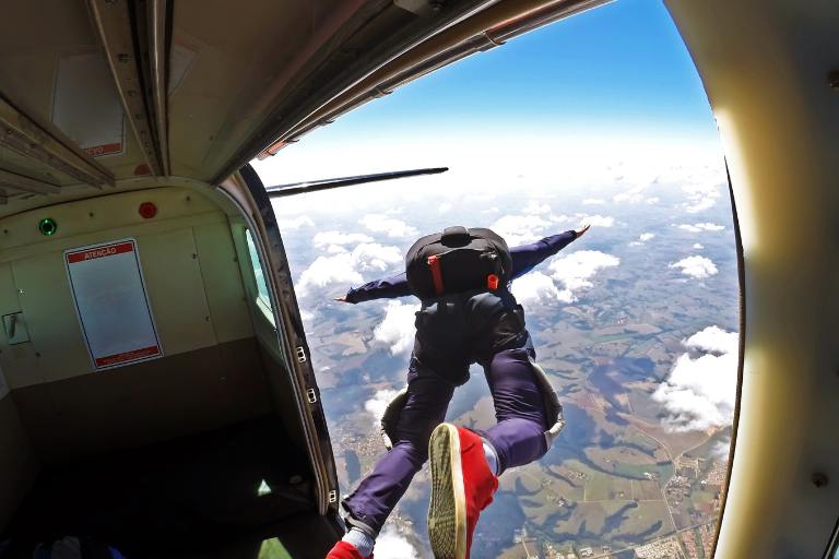 a person jumping from an airplane