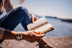 woman reading | travel and adventure books