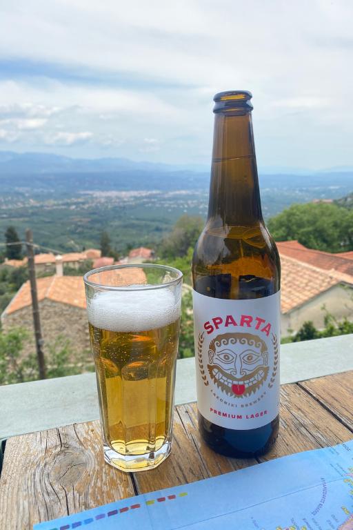 a bottle and glass of Sparta beer overlooking Sparta