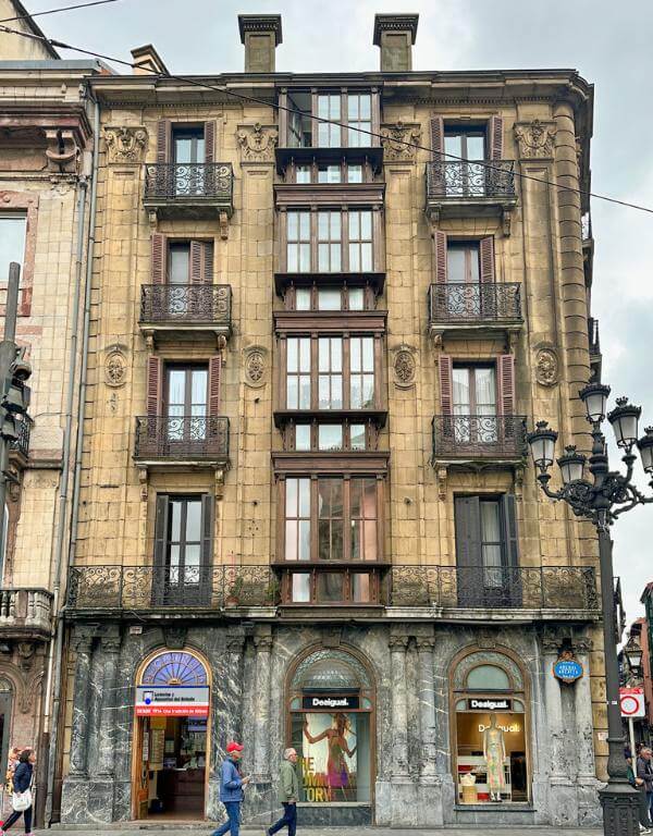 stone building with iron balconies