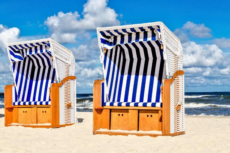 wicker chairs on beach in poland